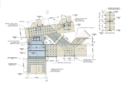 Detailansicht des Anschlusses einer Holzhalle mit klar sichtbaren Verbindungselementen und Holzstrukturen.