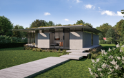 Eingangsbereich eines modernen Einfamilienhauses in Brandis mit großflächiger Glasfassade, Betonwänden, extensive Begrünung auf dem Flachdach und Holzterrassen im Garten. © STUDIO RALF HUG GmbH