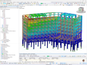 Windlastanalyse eines mehrgeschossigen Gebäude Tragwerks in RFEM mit farbiger Verformungsdarstellung und Tabelle der Massen- und Steifigkeitsmittelpunkte je Geschoss.