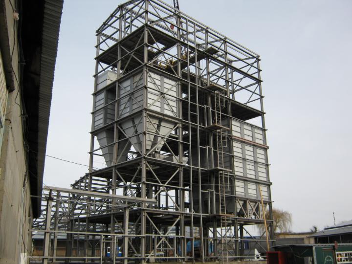 Steel structure with multiple silos shows industrial structural project in Ukraine.
