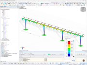 The graphic shows the deformation analysis of a structural model in RFEM under wind loads.