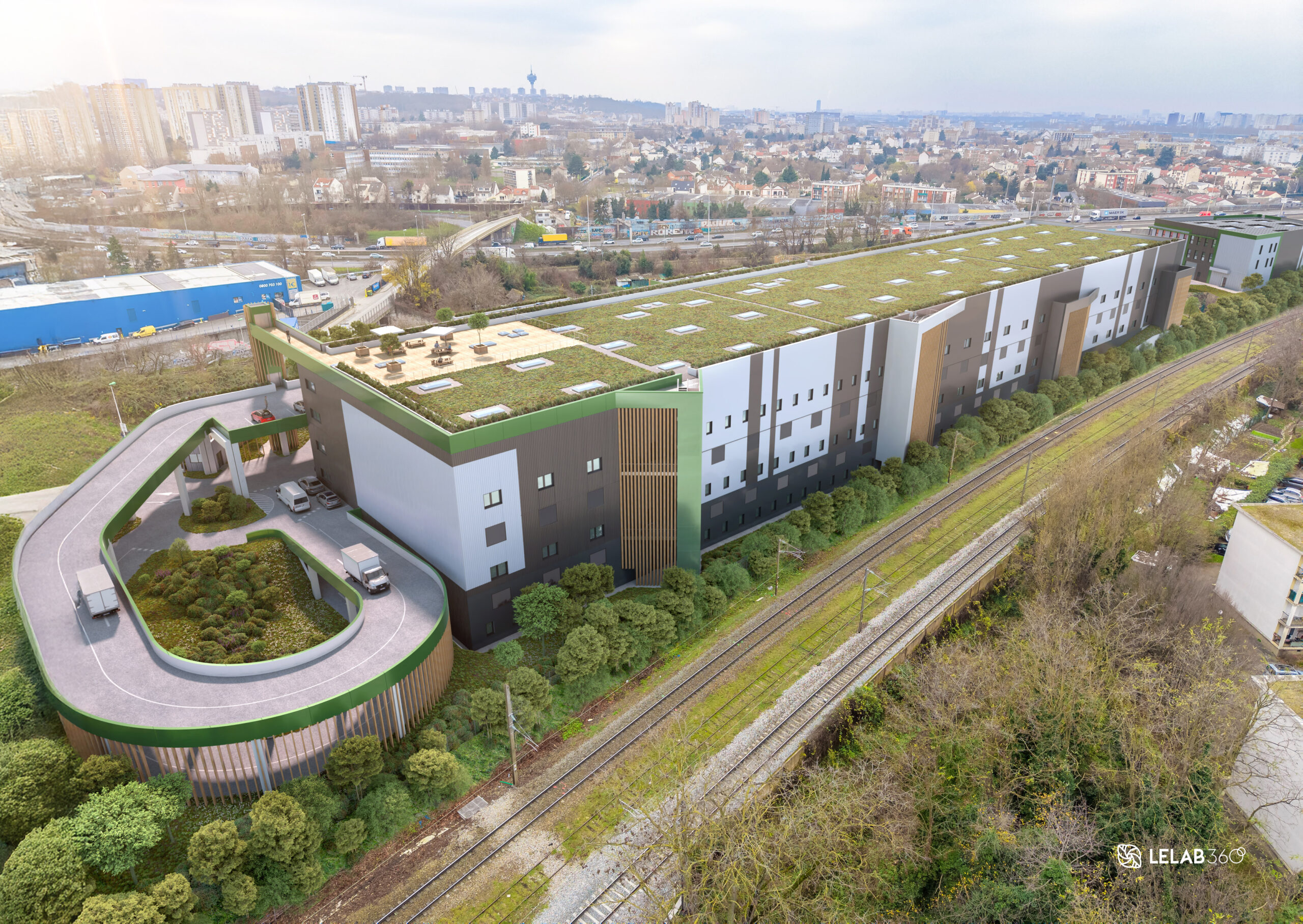 Vue arrière du futur site de La Factory, avec rampe et véhicules en accès | © AEW - STONEHEDGE