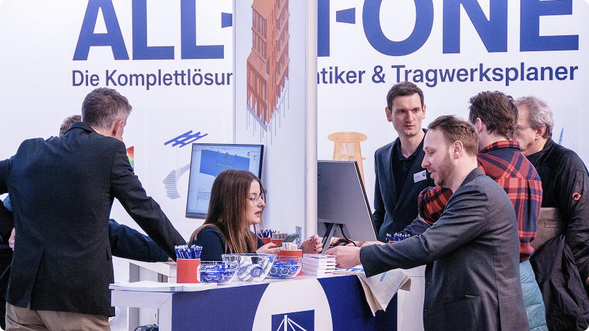 Les représentants de Dlubal Logiciel interagissant avec les visiteurs sur un stand de salon professionnel.